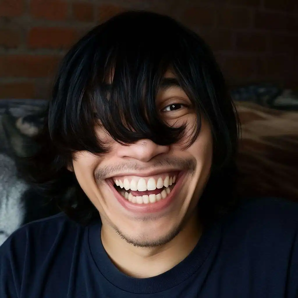 Funny selfie of a person with long hair covering one eye and a huge smile showing teeth