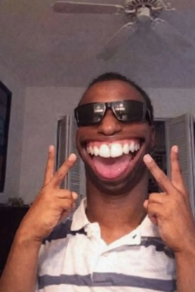 Goofy ahh meme of a man wearing sunglasses with exaggerated smile