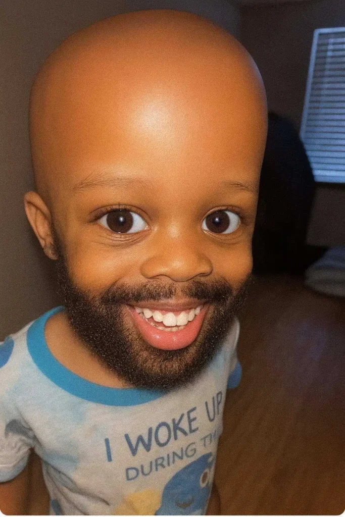 Humorous big-head effect portrait with exaggerated smile and wide eyes